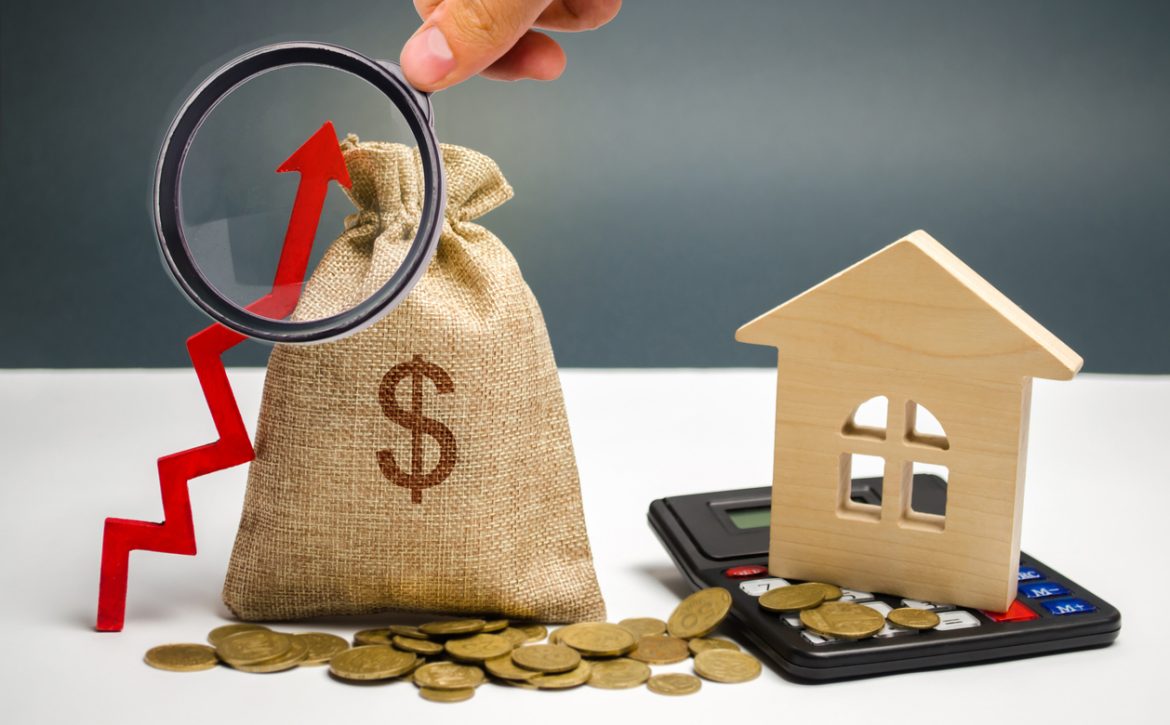 A bag with a dollar sign, an up arrow and a house. The concept of increasing the value of real estate. The increase in rents for housing. Raising interest rates on mortgages. Debt growth of house