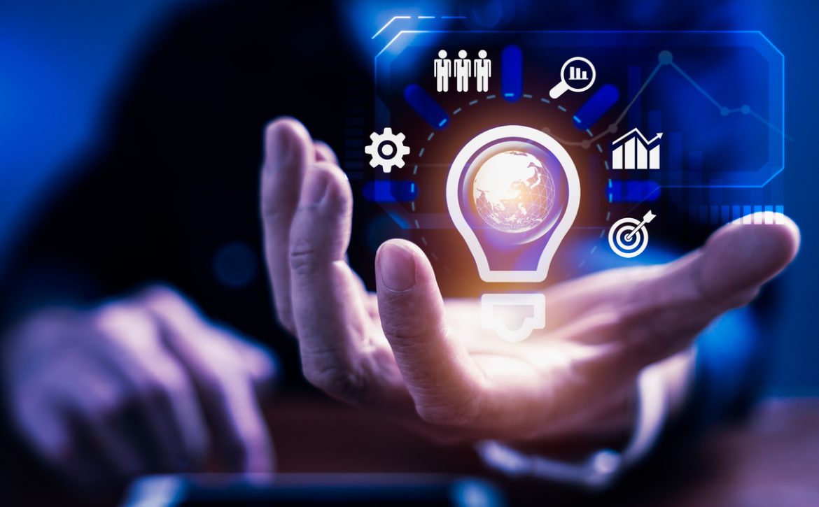 Businessman holding light bulb innovative technology virtual interface for creativity idea business management