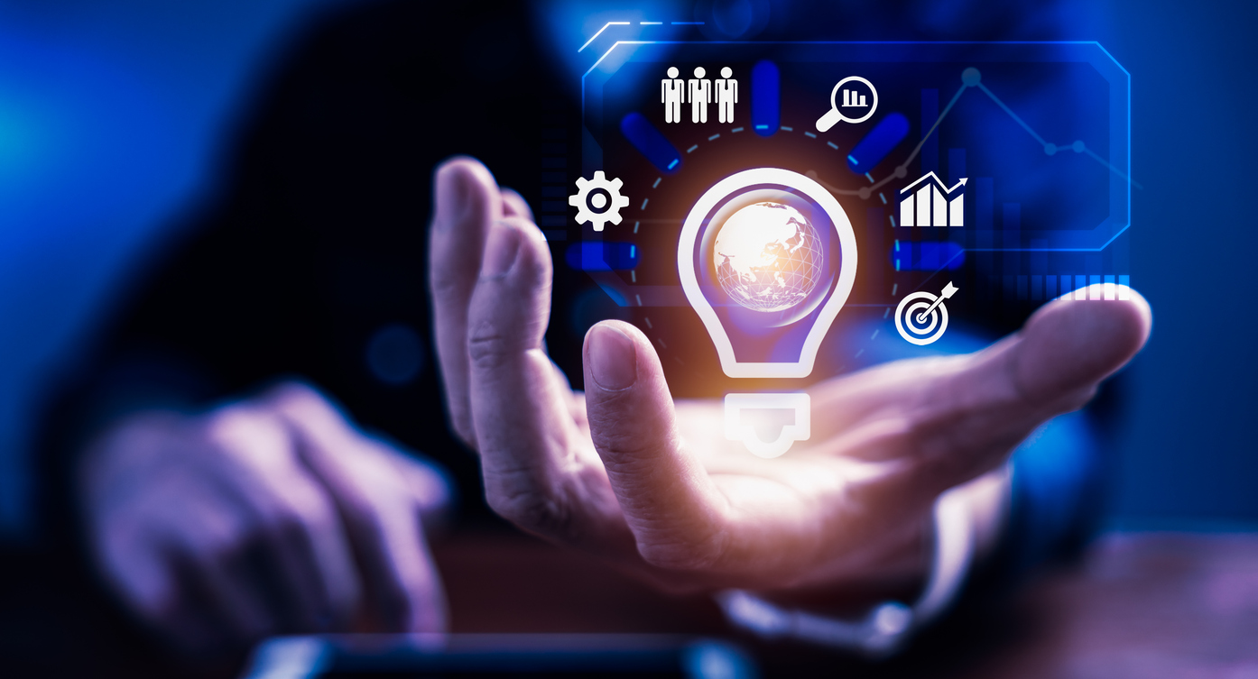 Businessman holding light bulb innovative technology virtual interface for creativity idea business management